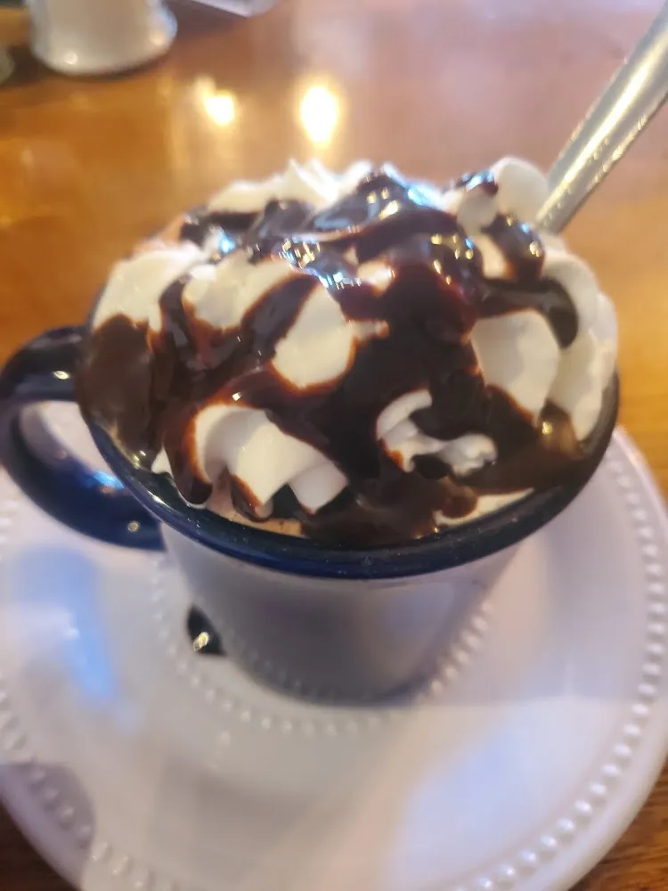 Hot Chocolate Served with Whip Cream Drizzle